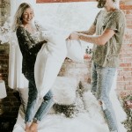 This Couple’s Pillow Fight Photo Shoot is Fun, Flirty, and Full of Feathers
