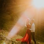 This Kananaskis Country Sweetheart Session Features Golden Light and a Bold Red Dress