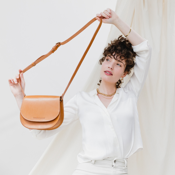 Portland Leather saddle bag with model holding