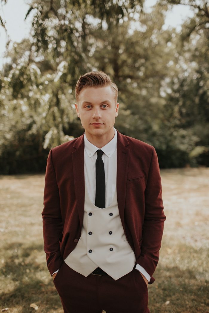 Handsome elegant bearded groom in checkered suit is standing on the bridge  in the forest. Stylish wedding grooms photo in brown leather shoes. Rustic  hipster portrait. 7101260 Stock Photo at Vecteezy