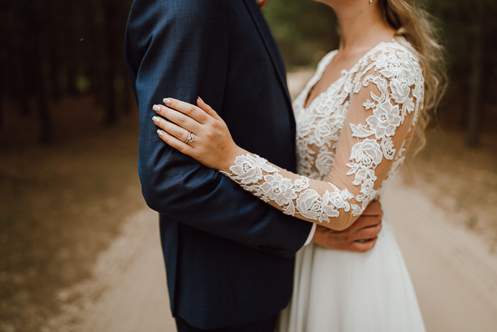 bride with hand on groom