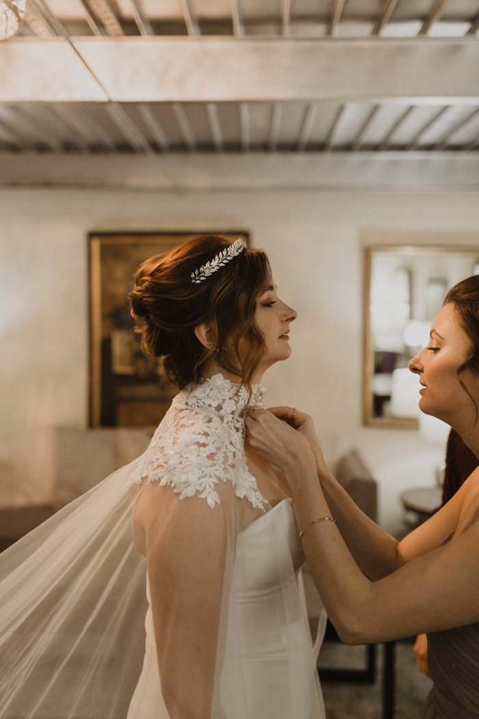 https://junebugweddings.com/wedding-blog/wp-content/uploads/2019/06/the-bridal-cape-in-this-tulsa-wedding-at-the-pearl-district-building-is-everything-payton-marie-photography-2.jpg