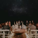 This Moody Boho Wolf Feather Honey Farm Wedding Features a Ceremony at Night