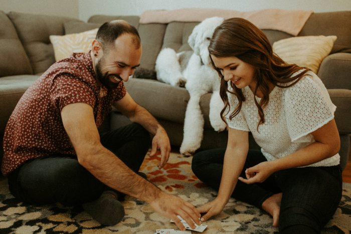 Relaxed Japanese Couple Chilling Together at Home, Using Gadgets