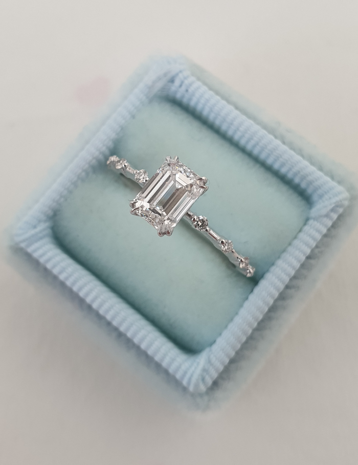 rectangle cut engagement ring in blue box