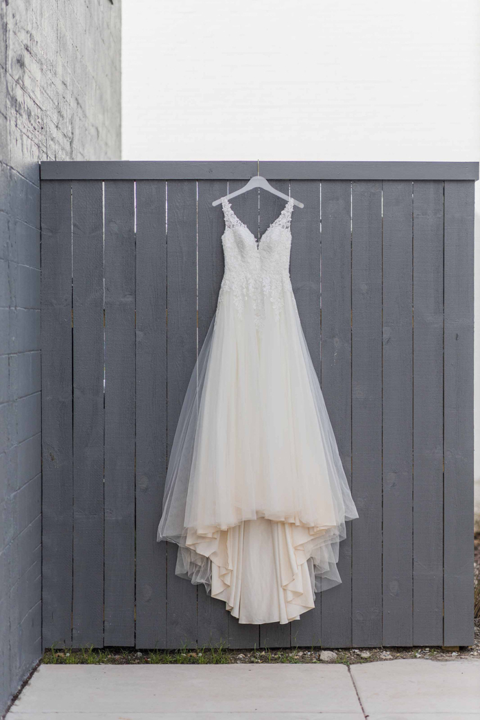 hanging wedding gown Wyeth Augustine Photography