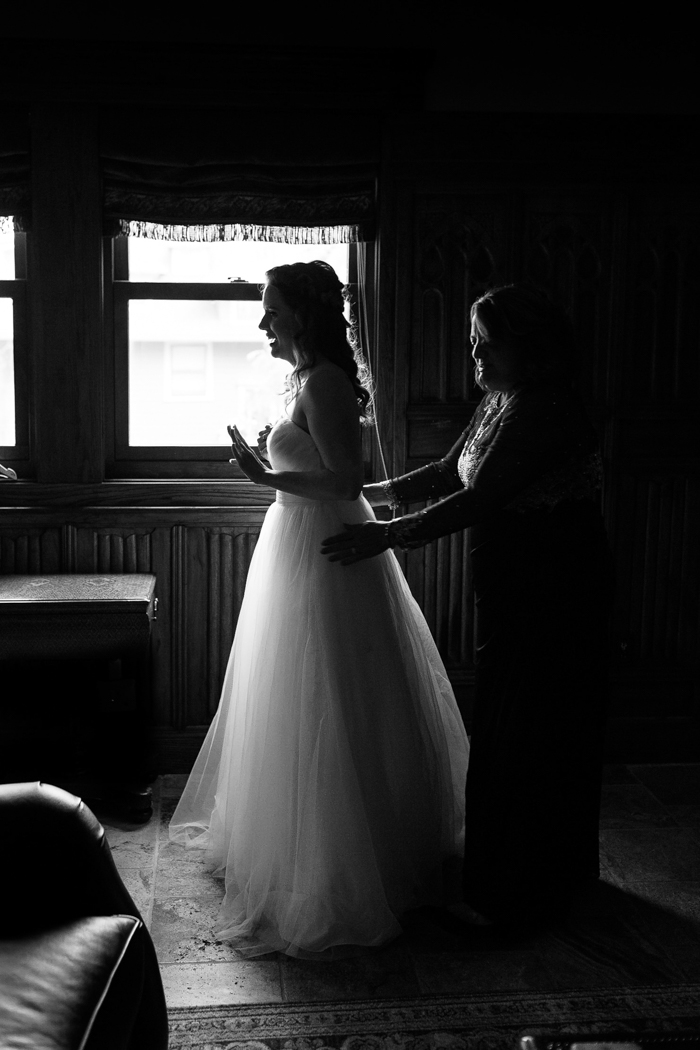 bride getting dressed for Moore's cove falls wedding