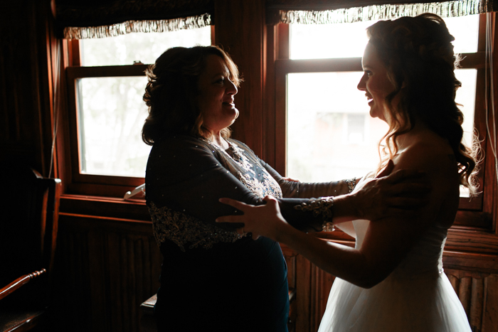 mother of bride and bride embracing