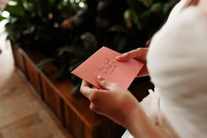 bride holding letter from loved ones