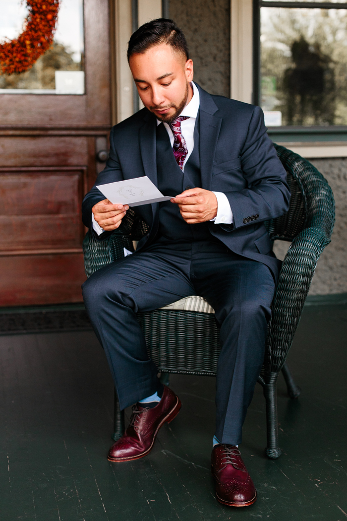 groom reading letter from the bride