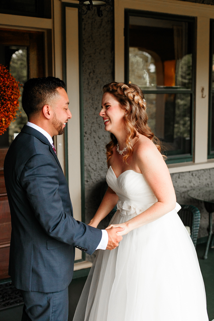 bride and groom laughing together