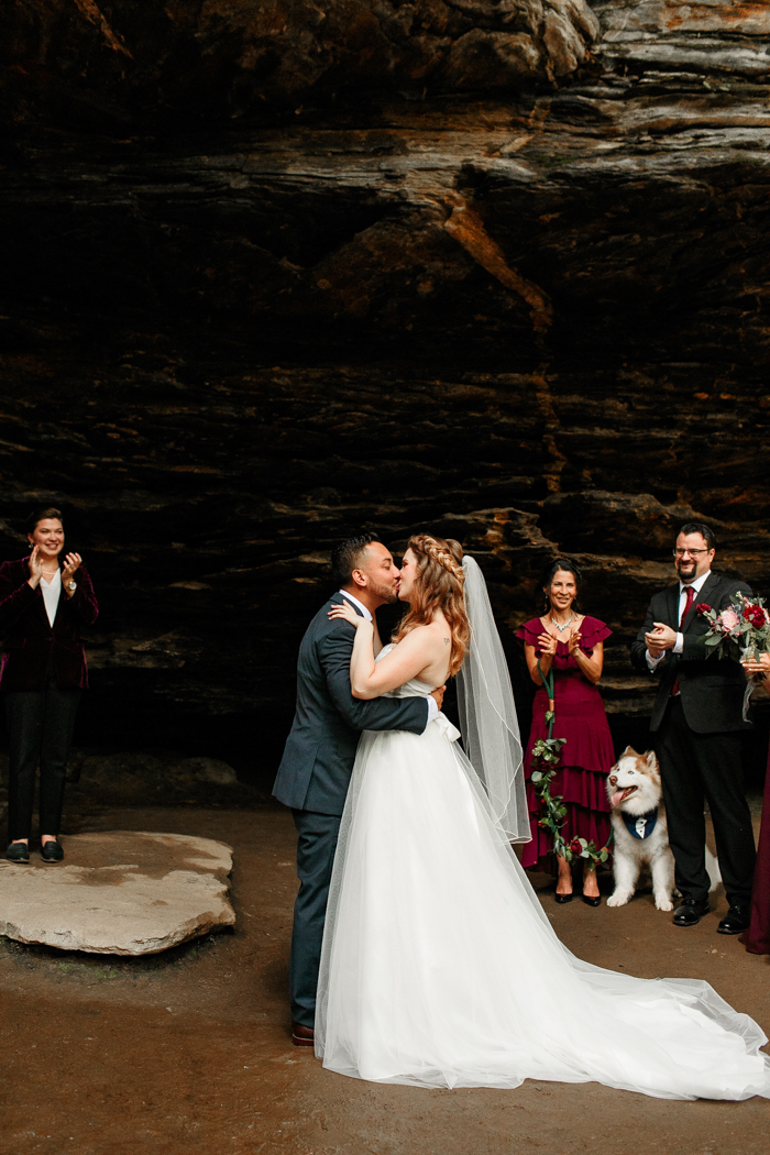 groom and bride kissing Moore's cove falls wedding