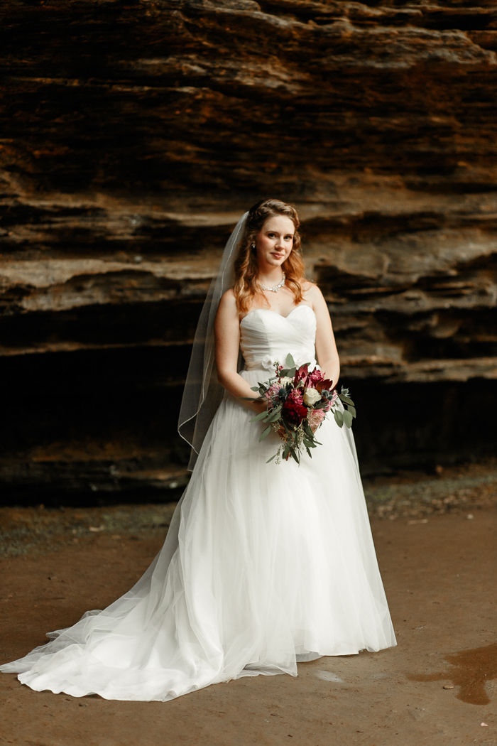 bride posing in Moore's cove falls wedding