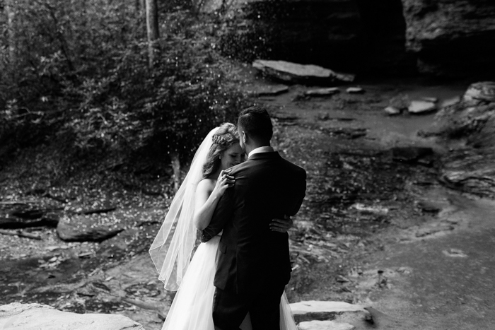 bride and groom dancing in black and white photo