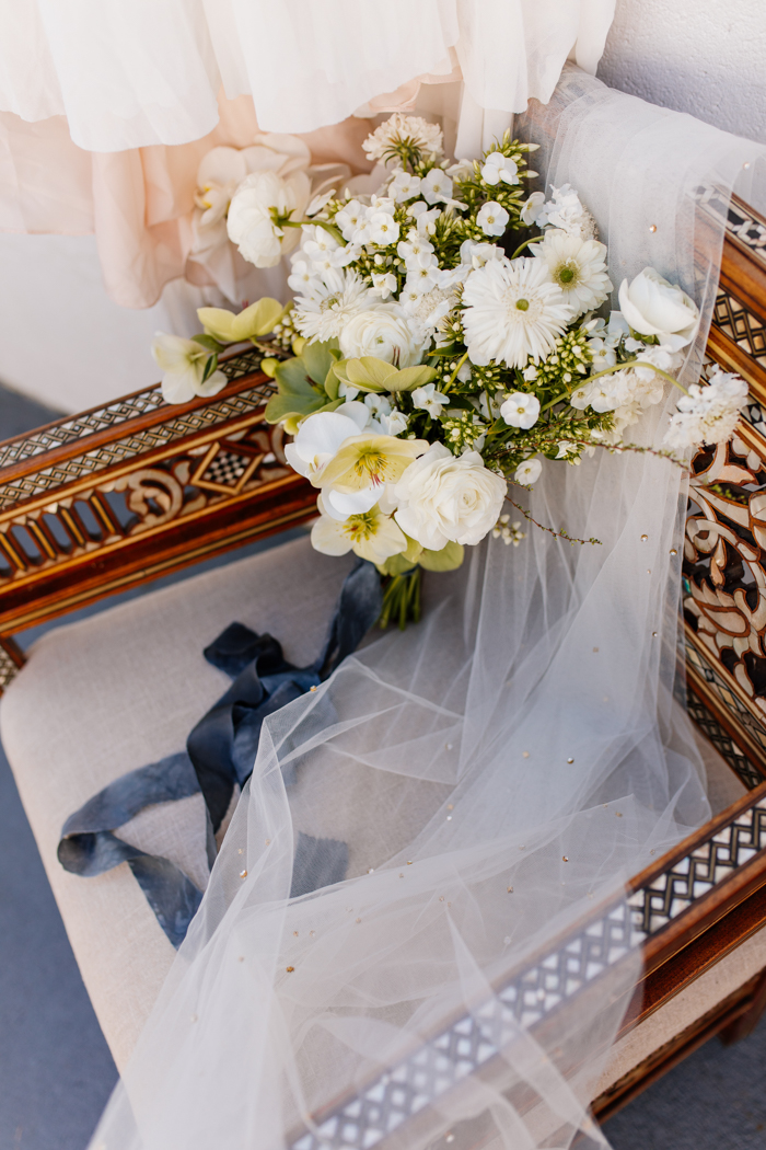 bridal bouquet sitting on a chair