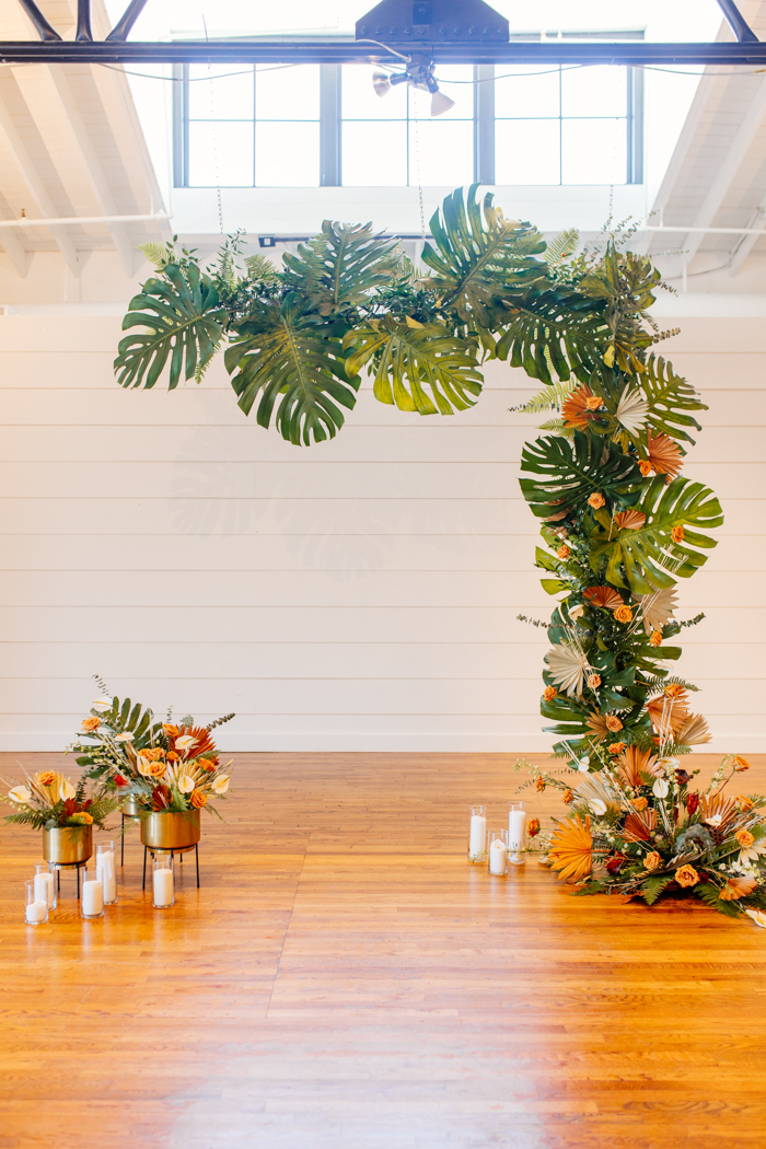 monstera ceremony backdrop