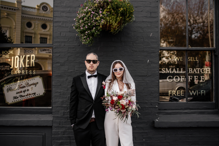 edgy micro wedding bride and groom posing together