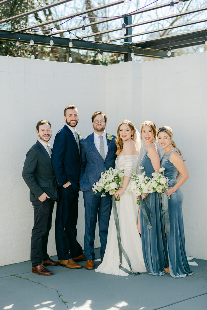 wedding party posing together