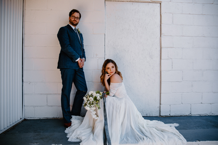 black sand beach wedding couple posing