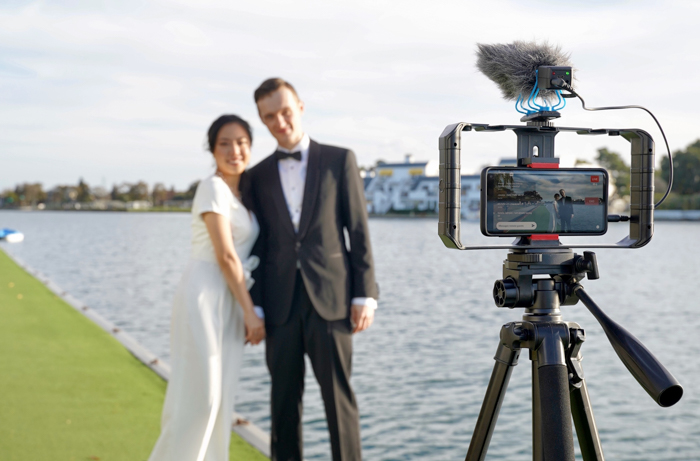 couple posing in front of virtual wedding