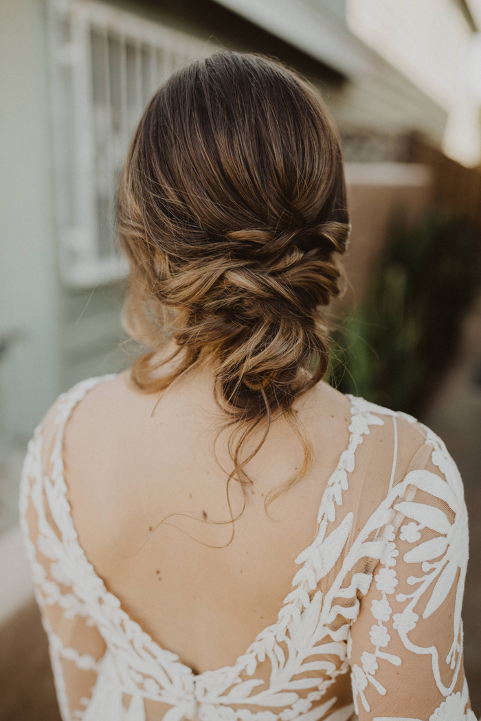Nailing The Perfectly Loose Low Bun - Camille Styles