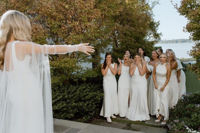 bride first look with her bridesmaids