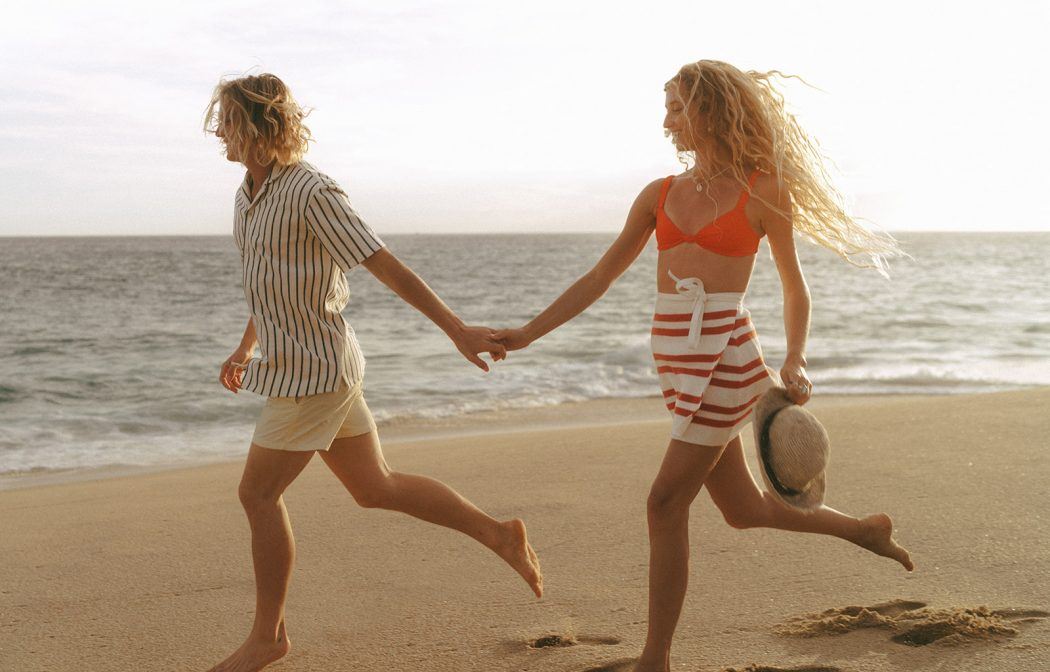 playful beach summer engagement