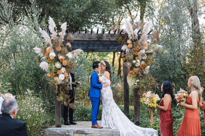 A Wedding Ceremony Trend We're Loving: Grounded Floral Arches