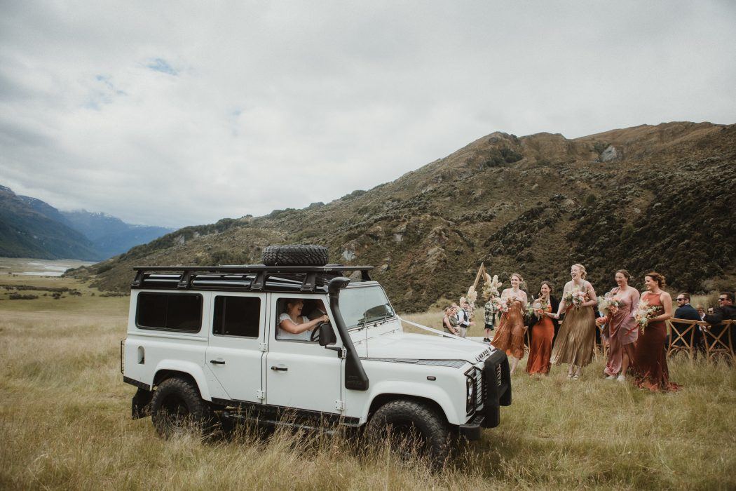 bride driving jeep after wedding
