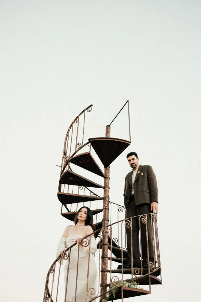 couple on floating spiral staircase