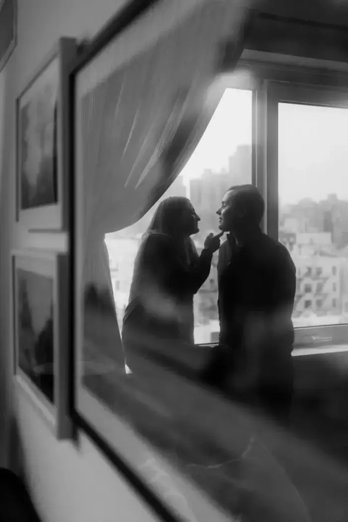 black and white engagement photo at home