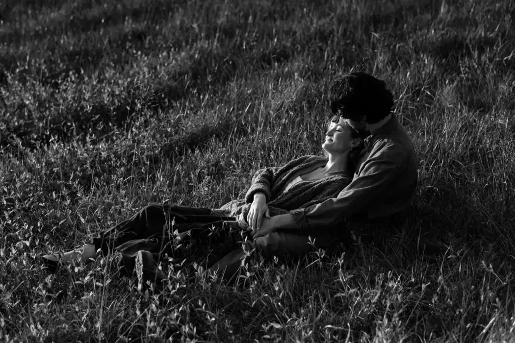 engaged couple in field
