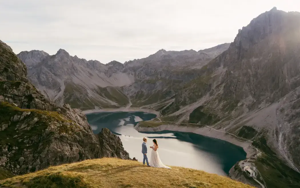 wedding day elopement couple by lake and mountains