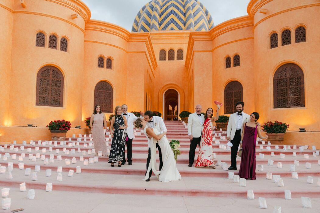 wedding day in front of colorful venue
